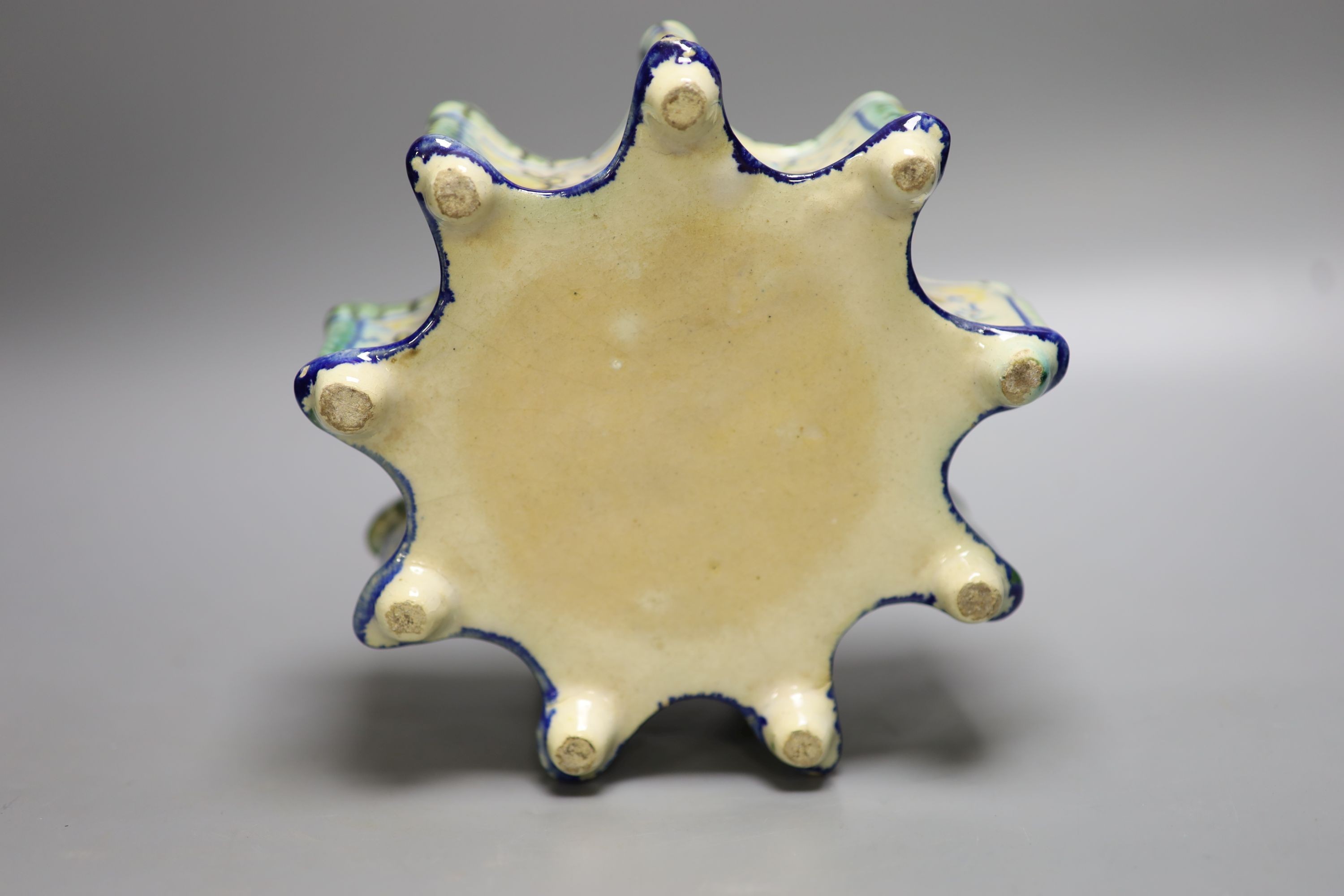 A 19th century Italian maiolica flower holder, of stellar form, 19cm diameter